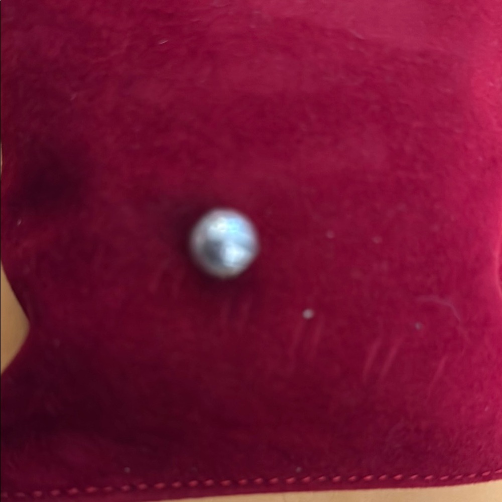 Elegant Pearl on Red Velvet Cushion